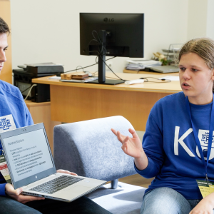 May be an image of 3 people, people studying and text.png